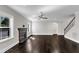 Bright and airy living room with fireplace, windows, and hardwood floors at 6332 Mountain Oaks Way, Wake Forest, NC 27587