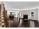 Spacious living room with fireplace, hardwood floors, and staircase at 6332 Mountain Oaks Way, Wake Forest, NC 27587