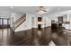 Open floor plan featuring hardwood floors, staircase, and kitchen at 6332 Mountain Oaks Way, Wake Forest, NC 27587