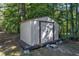 Metal storage shed nestled among mature trees at 6332 Mountain Oaks Way, Wake Forest, NC 27587