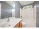 Well-maintained bathroom with a white vanity and shower-tub combination in a modern style at 709 Woodgreen Dr, Durham, NC 27704