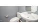 Small bathroom featuring a toilet and a white pedestal sink with silver hardware at 709 Woodgreen Dr, Durham, NC 27704
