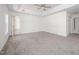 Bedroom with ceiling fan, wall-to-wall carpeting, and two entrances at 709 Woodgreen Dr, Durham, NC 27704