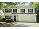 Charming two-story home with black shutters and a well-maintained front yard at 709 Woodgreen Dr, Durham, NC 27704
