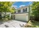 Charming two-story home with black shutters and a well-maintained driveway at 709 Woodgreen Dr, Durham, NC 27704