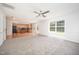 Bright living room featuring a ceiling fan and large window offering lots of natural light at 709 Woodgreen Dr, Durham, NC 27704
