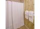 Bathroom features a shower with a white shower curtain at 714 Spring Ln, Sanford, NC 27330