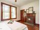 Bedroom features fireplace, hardwood floors, and natural light at 714 Spring Ln, Sanford, NC 27330