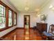 Dining room with hardwood floors, a chandelier, and access to the kitchen at 714 Spring Ln, Sanford, NC 27330