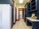 Hallway with custom blue cabinets, drawers, countertop, and tiled floor at 714 Spring Ln, Sanford, NC 27330