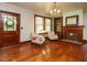 Elegant living room featuring hardwood floors, a fireplace, and a decorative chandelier at 714 Spring Ln, Sanford, NC 27330
