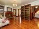 Spacious living room features hardwood floors, a fireplace, and custom built-in bookshelves at 714 Spring Ln, Sanford, NC 27330