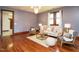 Cozy living room boasts hardwood floors, natural light, and comfortable seating arrangement at 714 Spring Ln, Sanford, NC 27330
