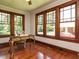 Office space with hardwood floors, wood trim windows, and a vintage desk at 714 Spring Ln, Sanford, NC 27330