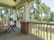 Relaxing covered porch perfect for enjoying the outdoors with serene backyard views at 714 Spring Ln, Sanford, NC 27330