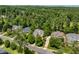 An aerial view featuring the house nestled in a neighborhood with mature trees at 812 Bear Tree Crk, Chapel Hill, NC 27517