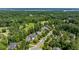 Scenic aerial view of the houses in a maturely landscaped neighborhood, near a golf course and lake at 812 Bear Tree Crk, Chapel Hill, NC 27517