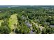 Aerial view of golf course community lush with dense tree coverage at 812 Bear Tree Crk, Chapel Hill, NC 27517