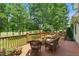 Outdoor deck with seating area and landscaping at 812 Bear Tree Crk, Chapel Hill, NC 27517
