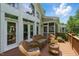 Inviting back deck offers comfortable wicker seating, perfect for enjoying the outdoor scenery at 812 Bear Tree Crk, Chapel Hill, NC 27517