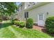 Well-maintained backyard features lush lawn and manicured landscaping around the home's perimeter at 812 Bear Tree Crk, Chapel Hill, NC 27517