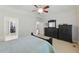 Carpeted bedroom with a ceiling fan, ensuite bathroom, and walk-in closet at 812 Bear Tree Crk, Chapel Hill, NC 27517