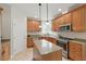 Kitchen features a kitchen island, modern appliances, stainless steel appliances, and ample cabinet storage space at 812 Bear Tree Crk, Chapel Hill, NC 27517