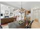 Spacious open concept living and dining area with wood floors and a view of the staircase at 812 Bear Tree Crk, Chapel Hill, NC 27517