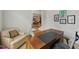 Comfortable office space with an oversized wood desk and sitting area at 812 Bear Tree Crk, Chapel Hill, NC 27517