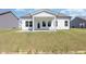 Home's back exterior features a covered patio, perfect for outdoor relaxation at 823 Biltmore Dr, Sanford, NC 27332