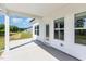 Covered back porch with ample space for outdoor seating and entertaining at 823 Biltmore Dr, Sanford, NC 27332