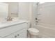 Modern bathroom with white cabinets, quartz countertop, and a tub/shower combination with tile surround at 823 Biltmore Dr, Sanford, NC 27332