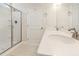 Modern bathroom featuring double sinks, a large mirror, and glass-enclosed walk-in shower at 823 Biltmore Dr, Sanford, NC 27332