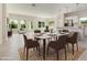 Open-concept dining area with modern furnishings, seamlessly connected to the kitchen for easy entertaining at 823 Biltmore Dr, Sanford, NC 27332