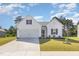Charming one-story home with a manicured lawn and a two-car garage, offering classic curb appeal at 823 Biltmore Dr, Sanford, NC 27332