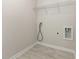 Efficient laundry area with shelving, and utility hookups, ready for appliances at 823 Biltmore Dr, Sanford, NC 27332