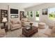 Bright and inviting living room featuring a modern fireplace, stylish furnishings, and scenic outdoor views at 823 Biltmore Dr, Sanford, NC 27332