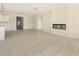 Spacious and bright living area with modern lighting, a sleek fireplace, and seamless access to the kitchen at 823 Biltmore Dr, Sanford, NC 27332