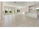 Open-concept living space with light wood floors, an adjacent kitchen, and plenty of natural light at 823 Biltmore Dr, Sanford, NC 27332