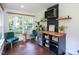Charming bar area featuring beverage cooler, wine wrack, butcher block counter, and comfortable seating at 8604 Timberwind Dr, Raleigh, NC 27615