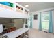Bedroom featuring built-in bunk bed and desk, natural light, and neutral walls at 8604 Timberwind Dr, Raleigh, NC 27615