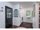 Bright laundry room with front-loading washer and dryer, window with natural light, and tasteful decor at 8604 Timberwind Dr, Raleigh, NC 27615