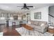 Bright open-concept space featuring white kitchen, dining area, living room with wood floors, and neutral modern finishes at 8604 Timberwind Dr, Raleigh, NC 27615