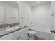 Bathroom with granite countertops, tub, and ample natural light at 87 Royal Meadow Dr, Angier, NC 27501