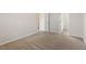 Cozy bedroom with neutral carpeting, a doorway to an ensuite bathroom, and a walk-in closet at 87 Royal Meadow Dr, Angier, NC 27501