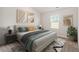 Bright bedroom featuring a comfortable bed, stylish decor, and natural light from a window at 87 Royal Meadow Dr, Angier, NC 27501