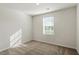 Carpeted bedroom with a window, blinds, and neutral color palette at 87 Royal Meadow Dr, Angier, NC 27501