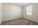 Cozy carpeted bedroom with natural lighting from the window at 87 Royal Meadow Dr, Angier, NC 27501