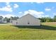 Exterior side view of home with large yard under a sunny sky at 87 Royal Meadow Dr, Angier, NC 27501