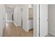 Hallway view with wood floors and access to different rooms at 87 Royal Meadow Dr, Angier, NC 27501